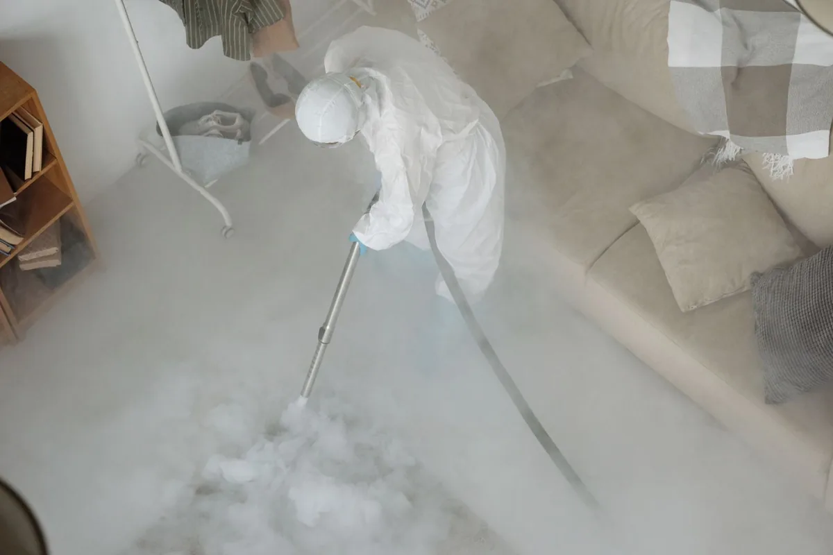 Biohazard cleanup technician in protective equipment, Calwa, CA